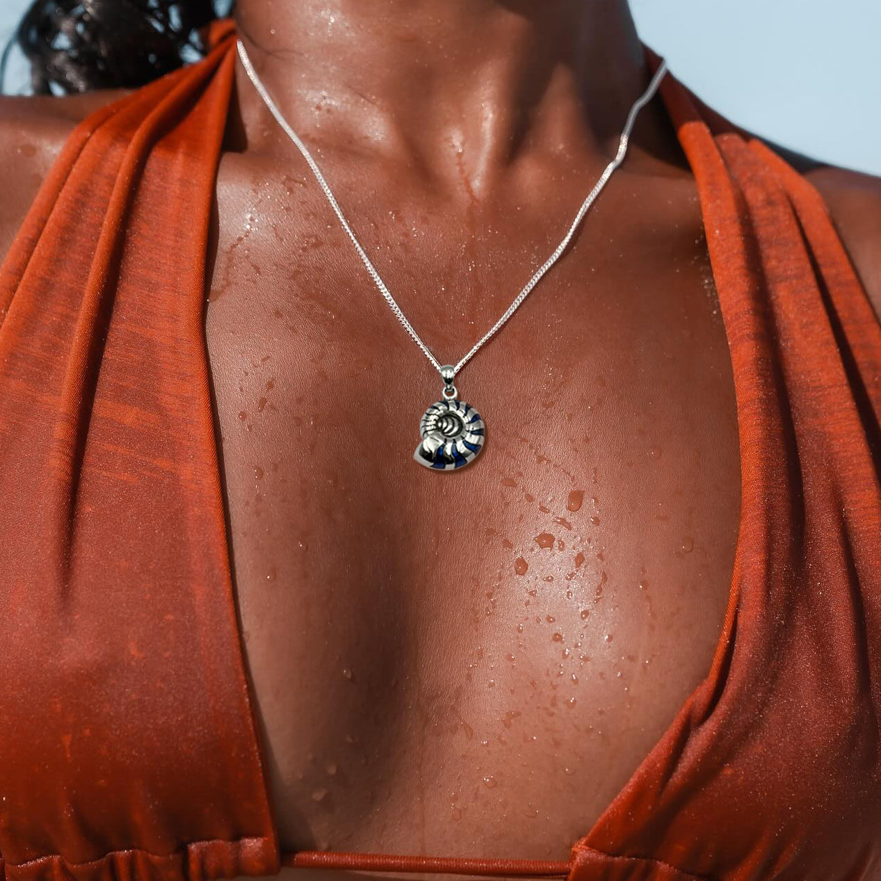 Charmed by the Rhythmic Spiral Sterling Silver Nautilus Pendant TP3106